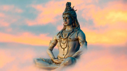 Beautiful statue of Lord Shiva meditating with clouds and sunset, depicting Shri Shiv Ji Ki Aarti