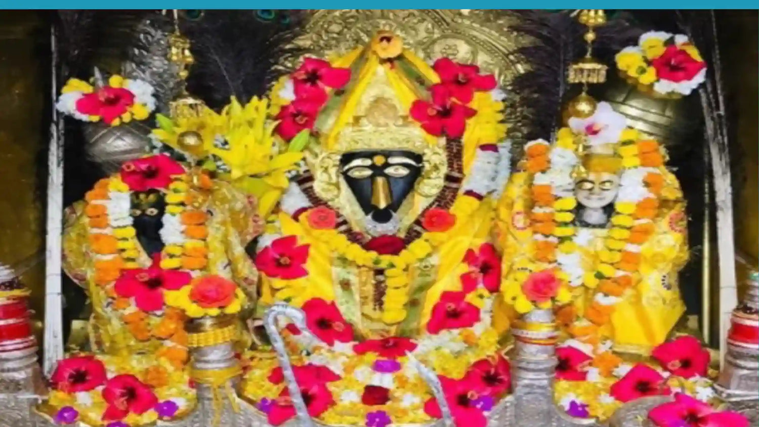 Idols decorated with flowers and garlands in a shrine representing Shri Bagalamukhi Mata for Shri Bagalamukhi Mata Chalisa