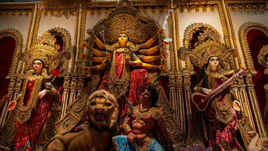 Decorative idols of Durga and other deities with intricate designs showcasing Siddha Kunjika Stotram theme