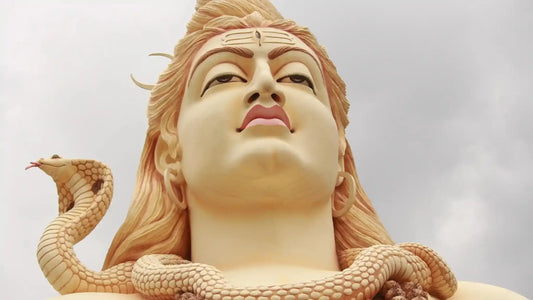 Majestic statue of Lord Shiva with a serpent, symbolizing Somwar Ki Aarti significance