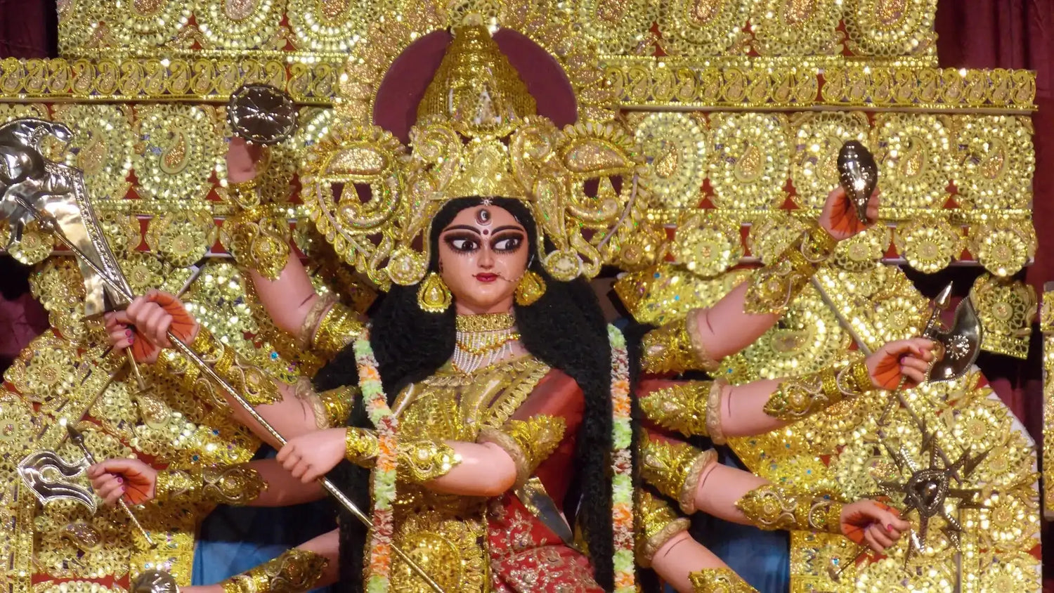 Idol of Goddess Durga adorned in gold detail representing Bhagavati Mata Stotram