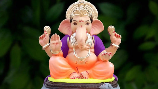 Shree Ganesh Aarti statue showing Lord Ganesh in a colorful design with ornate detailing