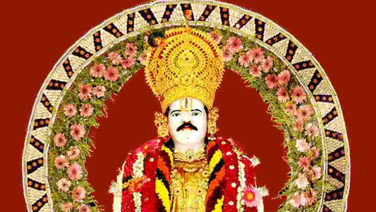 Colorful image of a deity statue adorned with flowers and jewelry representing Shri Baba Gangaram Chalisa