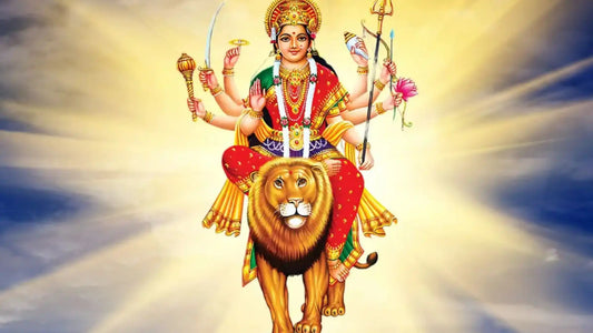 Goddess Durga on a lion, representing the Mahishasura Mardini Stotram in a radiant backdrop