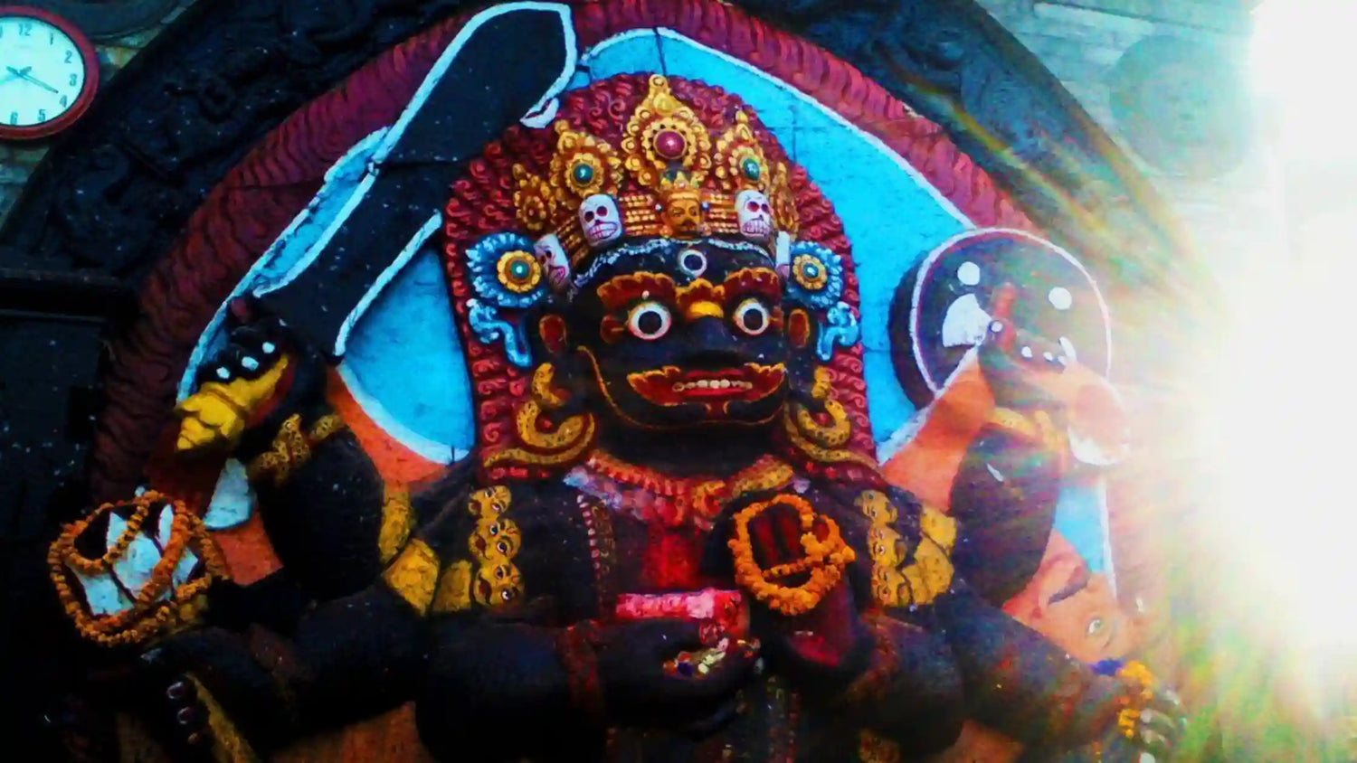 Colorful statue of deity representing Shri Batuka Bhairava with intricate details and bright decorations