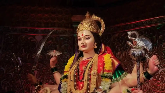 Statue of a goddess adorned with flowers, representing the devotion in Ath Keelakam Stotram