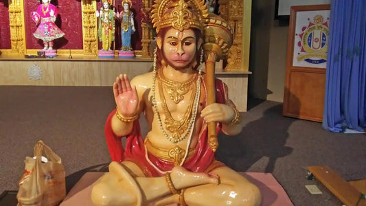 Vibrant idol of Shree Hanuman Ji Aarti in a spiritual setting with traditional decor