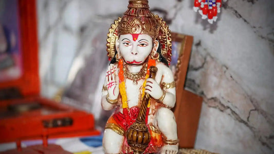 Beautiful idol of Lord Hanuman playing the veena, representing Shri Pavanasuta Hanuman Aarti