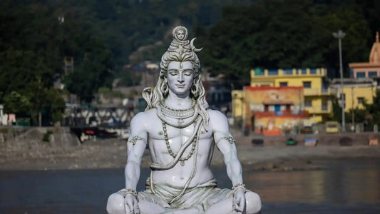 Idol of Lord Shiva symbolizing the Shiva Panchakshara Stotram in a serene riverside setting