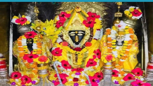 Idols decorated with flowers and garlands in a shrine representing Shri Bagalamukhi Mata for Shri Bagalamukhi Mata Chalisa