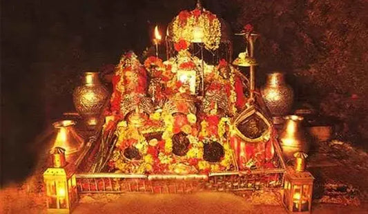 Shri Vaishno Mata Aarti setup adorned with flowers, lights, and traditional offerings for worship